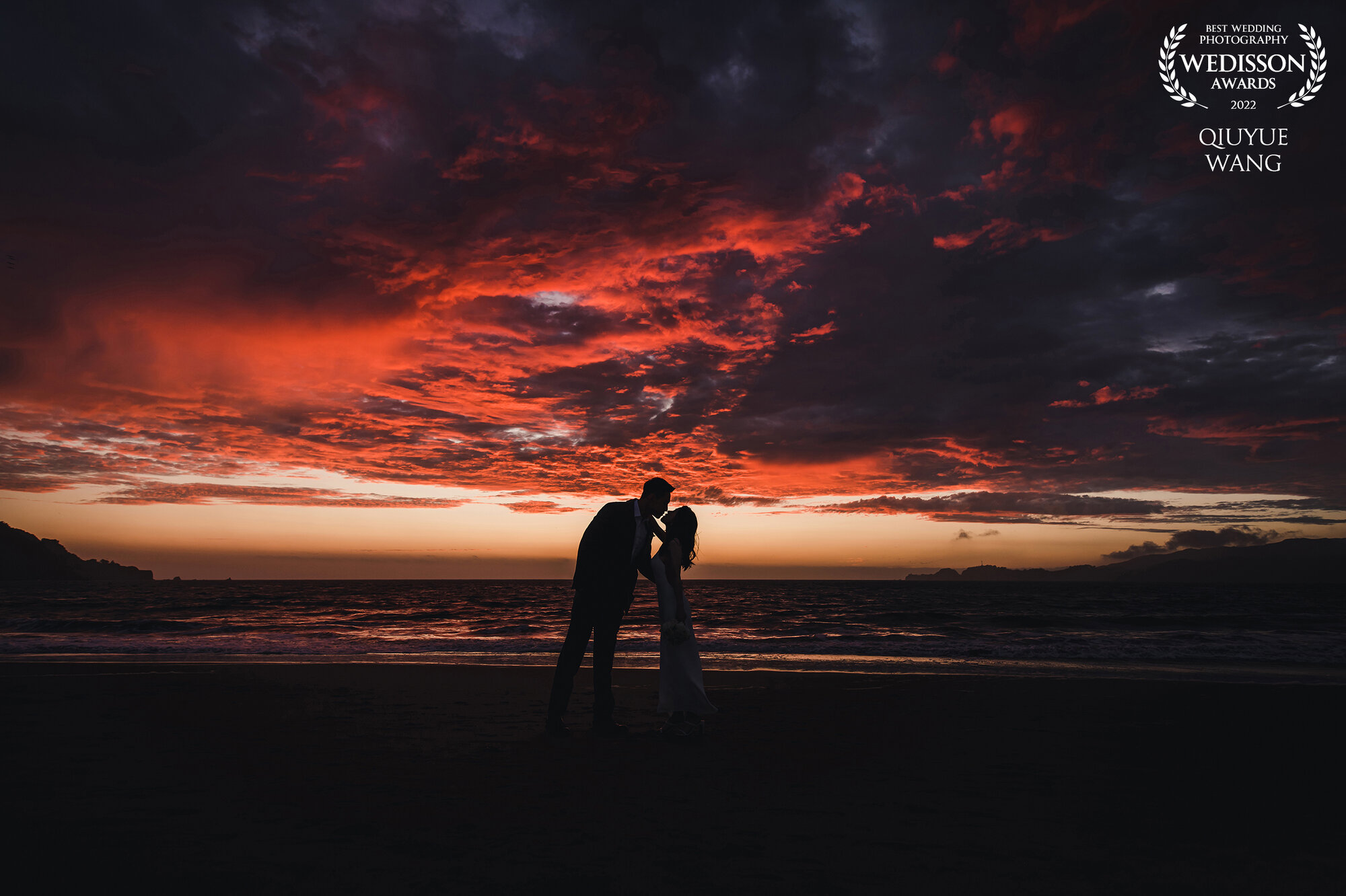 Award-winning red sunset silhouette photograph by The Moment Photo Studio