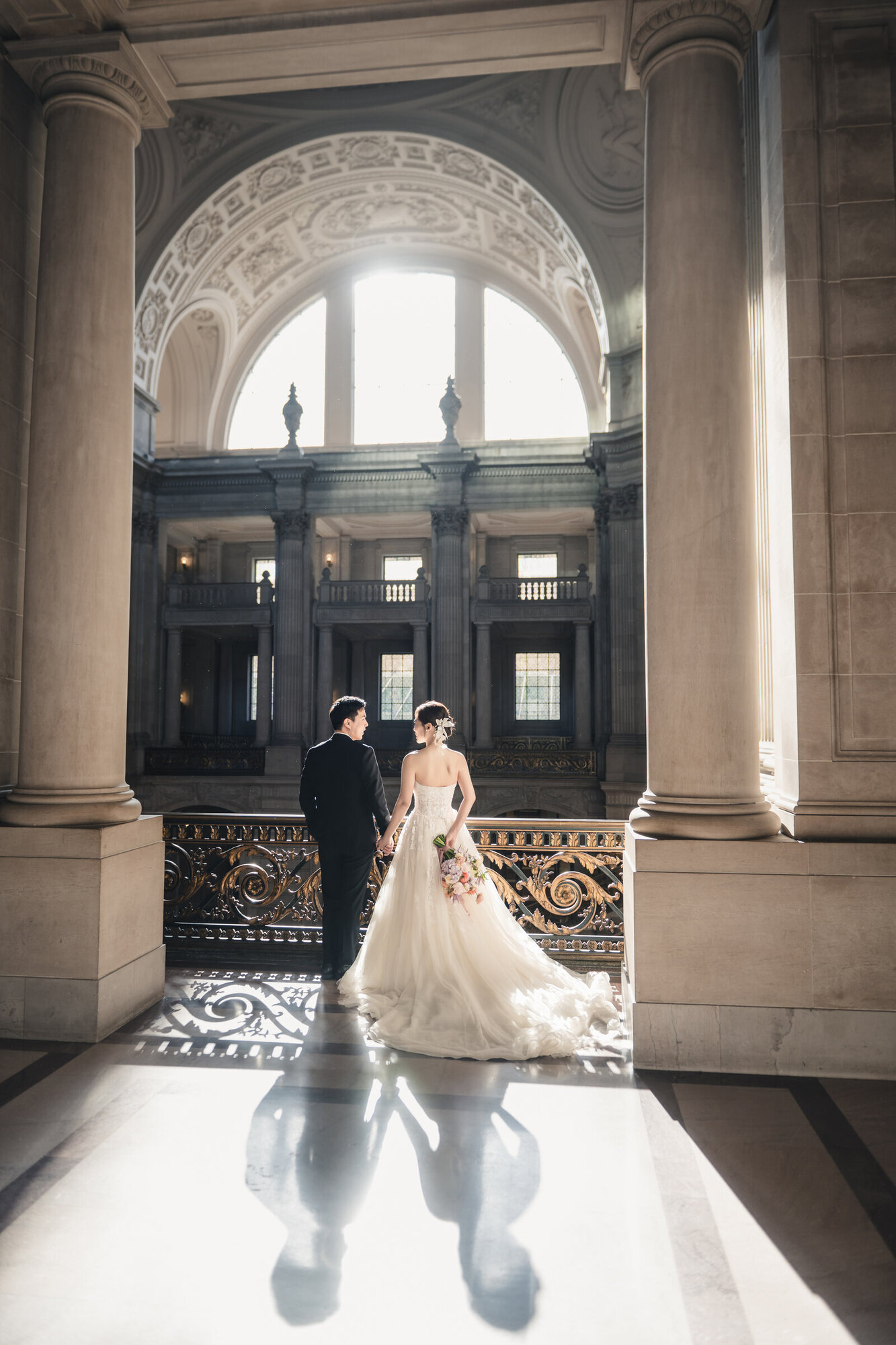 Vertical bridal portrait by the window at San Francisco City Hall