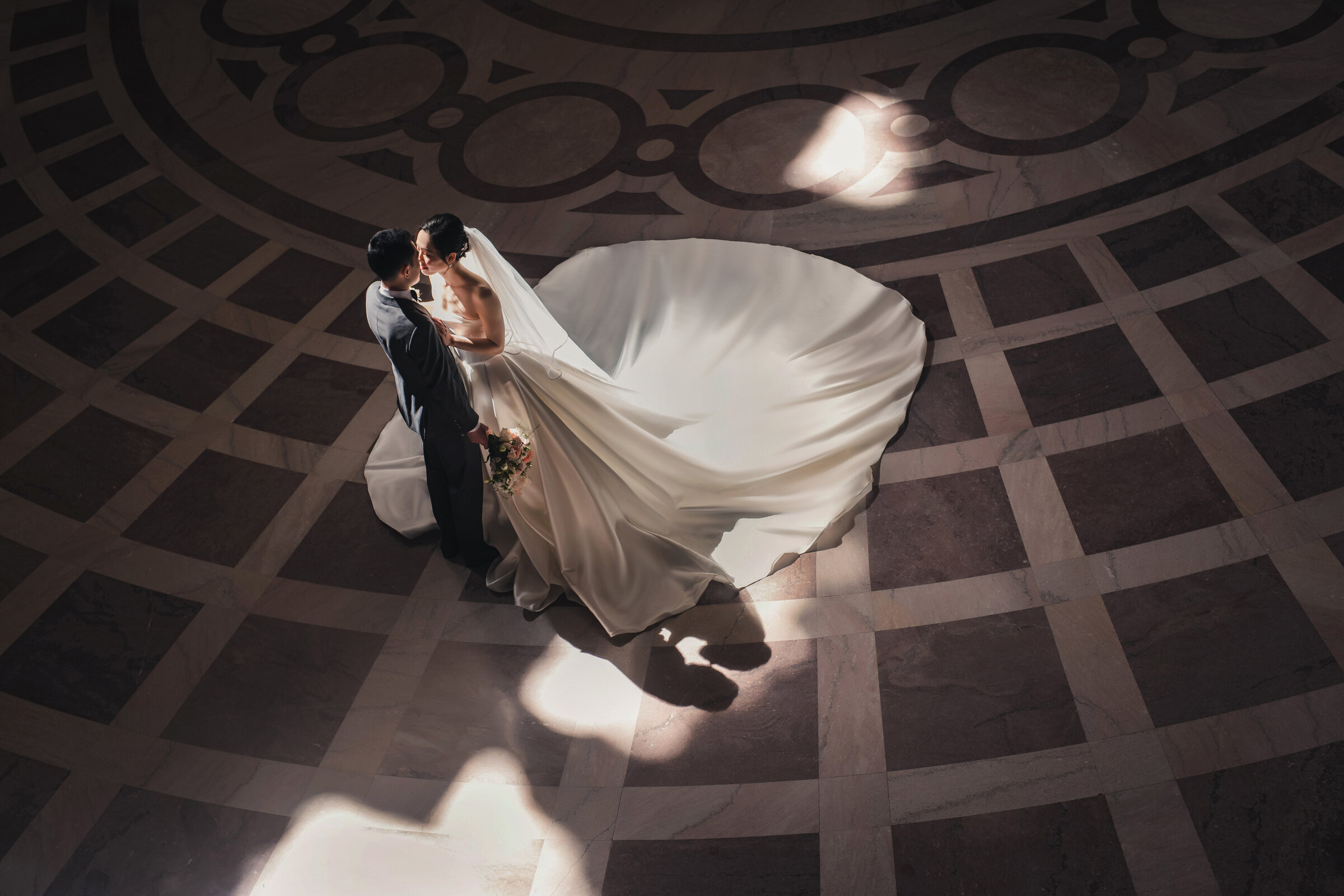 Overhead wedding portrait with dramatic floor shadows