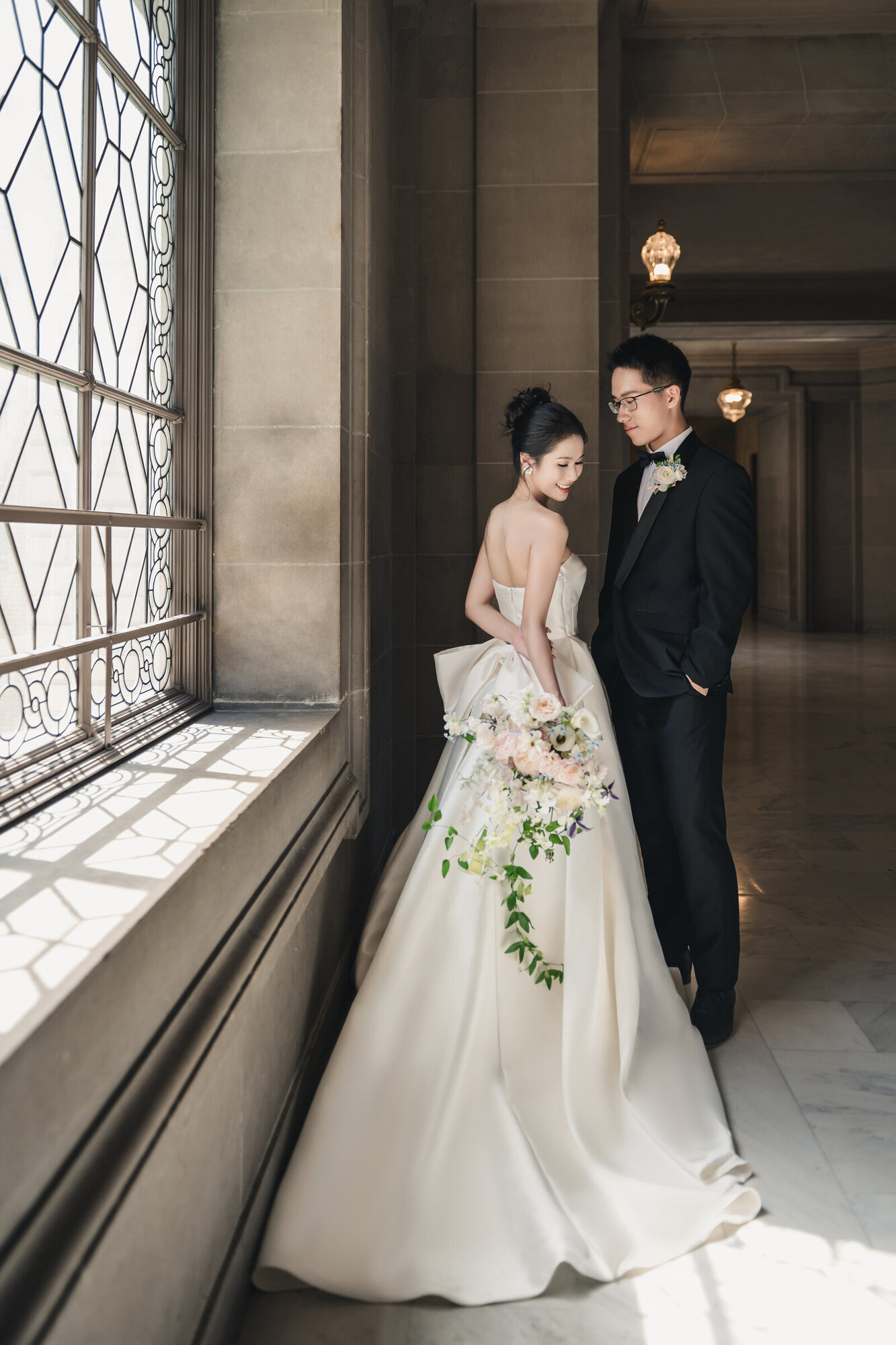 Window-light couple portrait at San Francisco City Hall