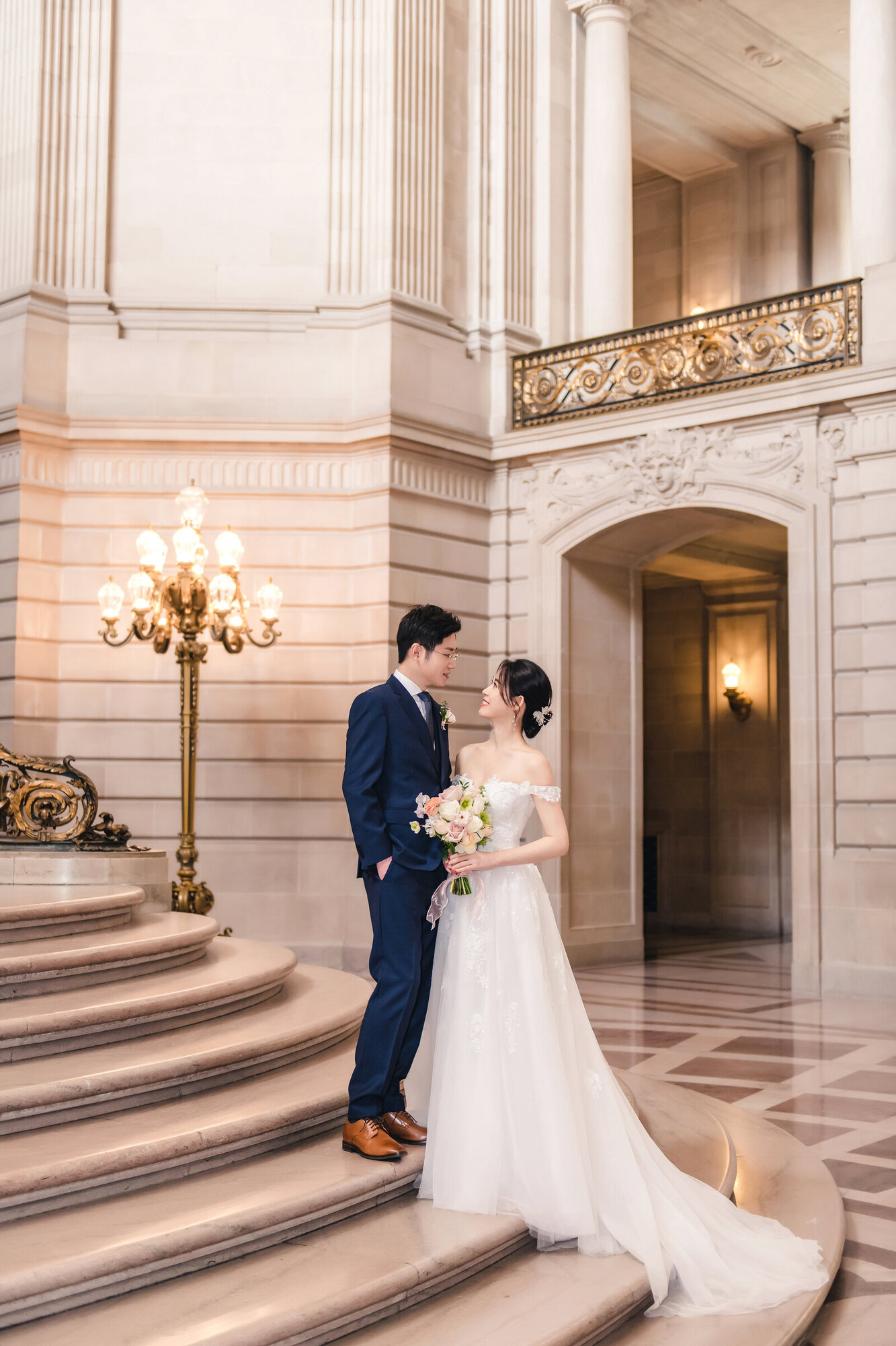 Couple portrait on the City Hall staircase