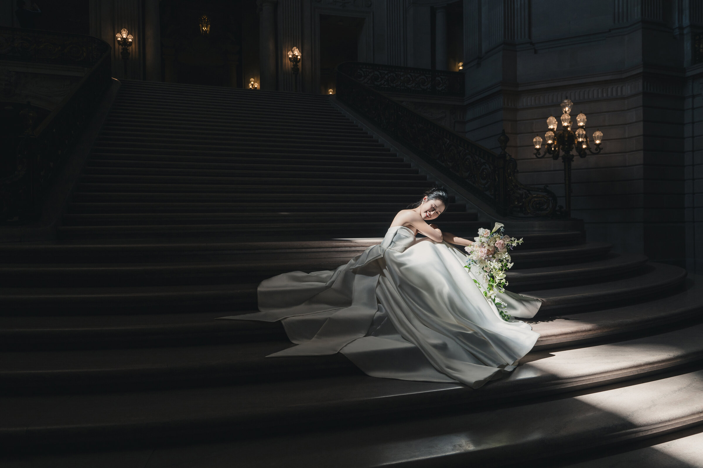 Dramatic reclined bridal portrait on the staircase
