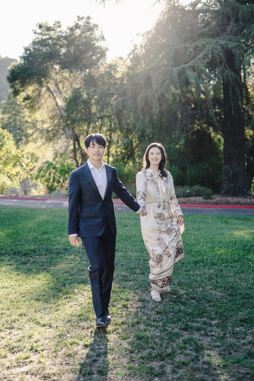 Parents walking together across the lawn