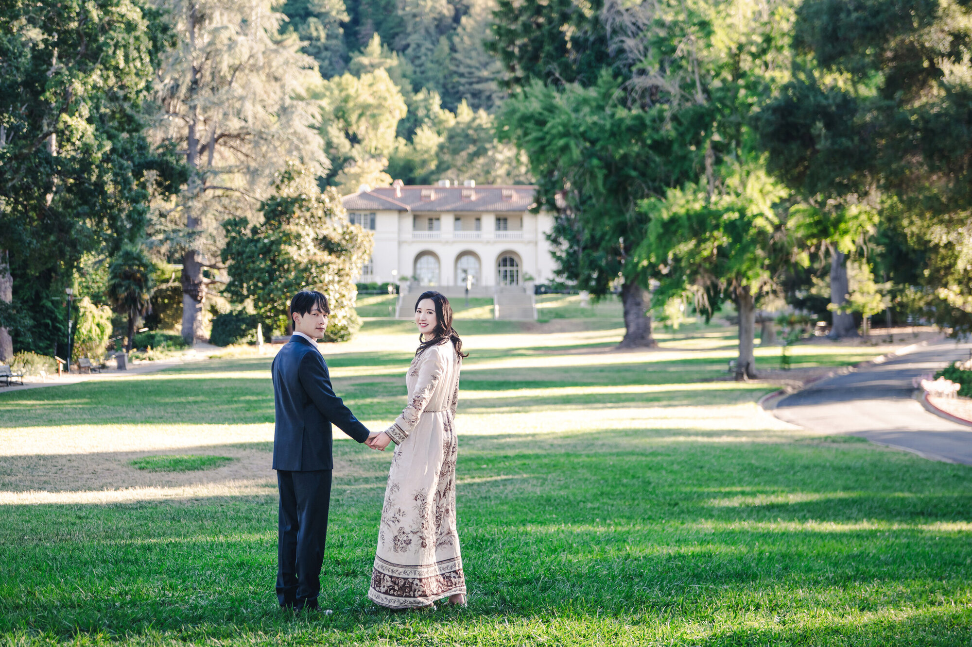 Quiet family season portrait in a wide lawn setting