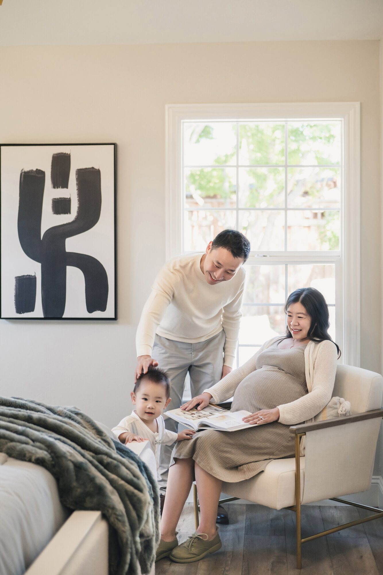 Warm family maternity portrait at home