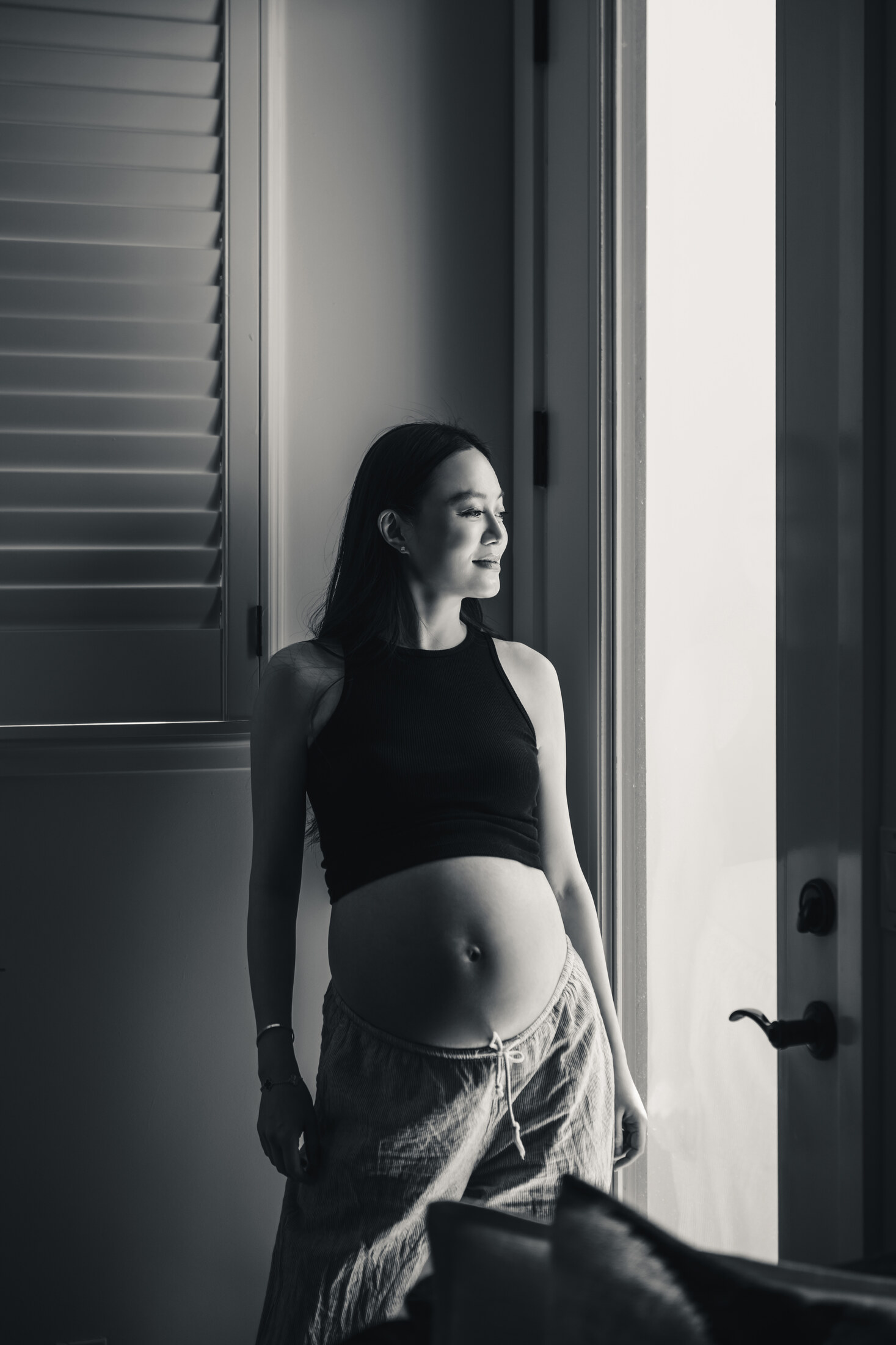 Black and white maternity portrait by window light