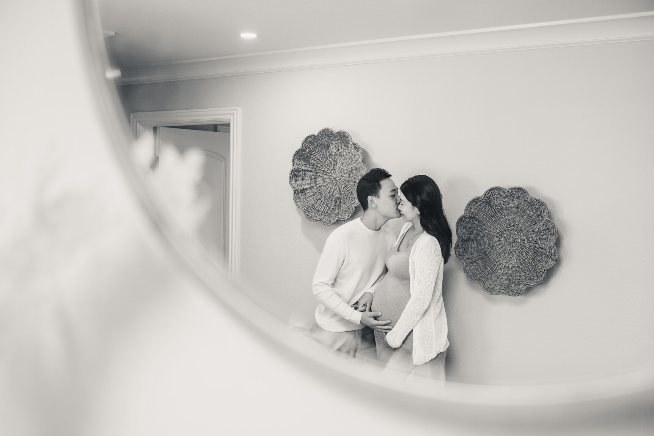 Black and white maternity portrait with negative space