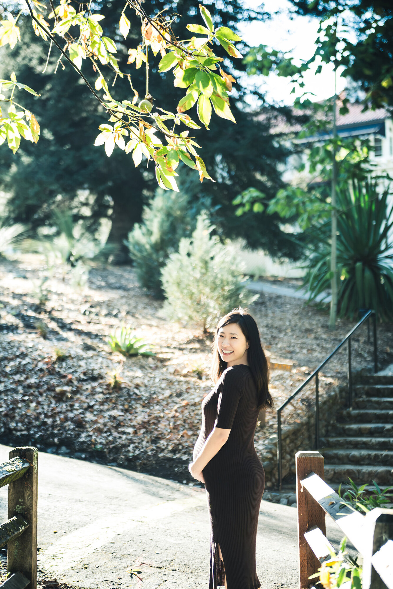 Maternity portrait on garden stairs