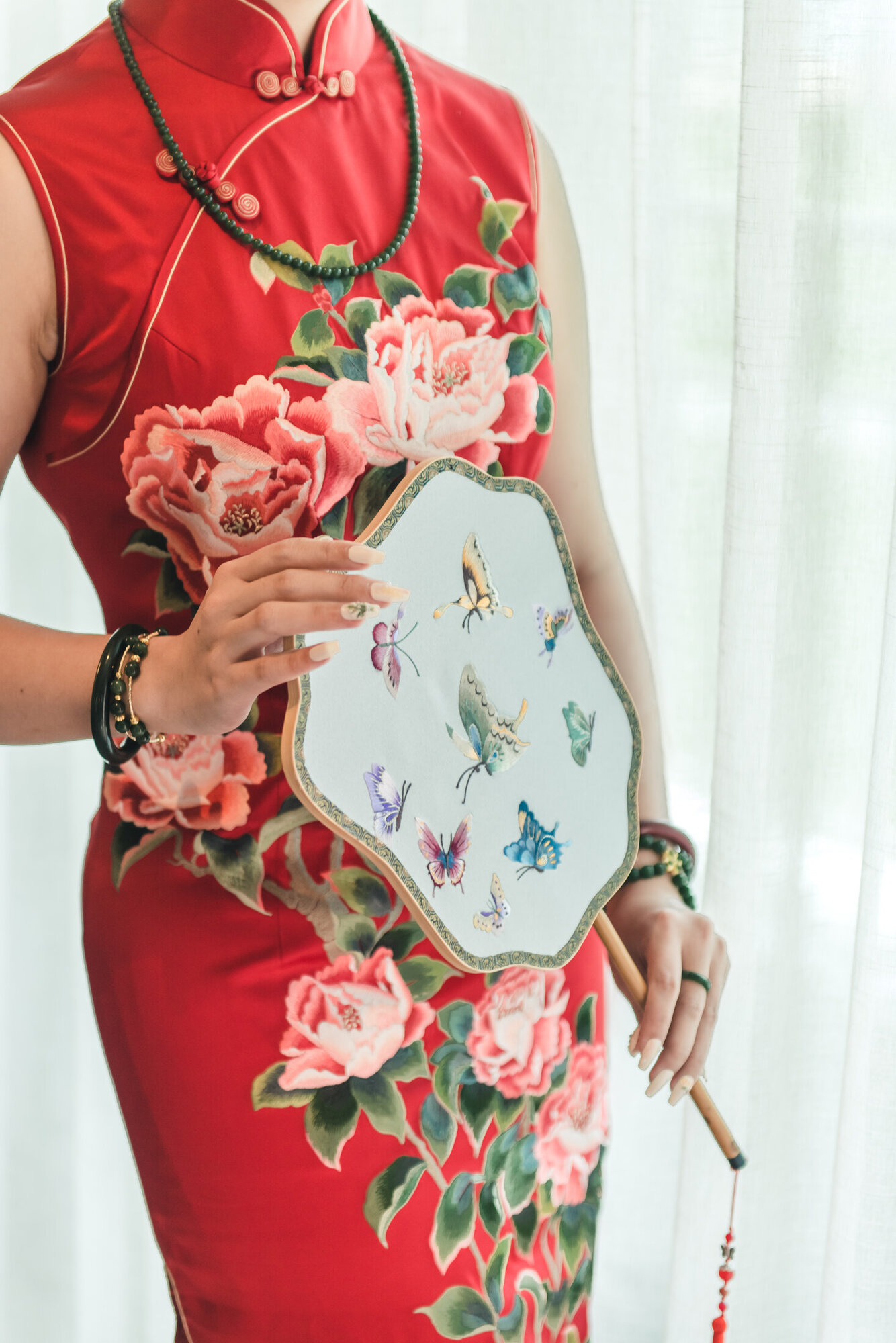 Red dress and fan detail
