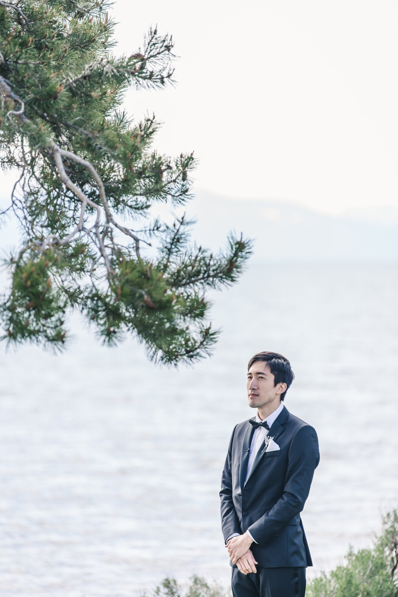 Groom waiting by Lake Tahoe before the ceremony