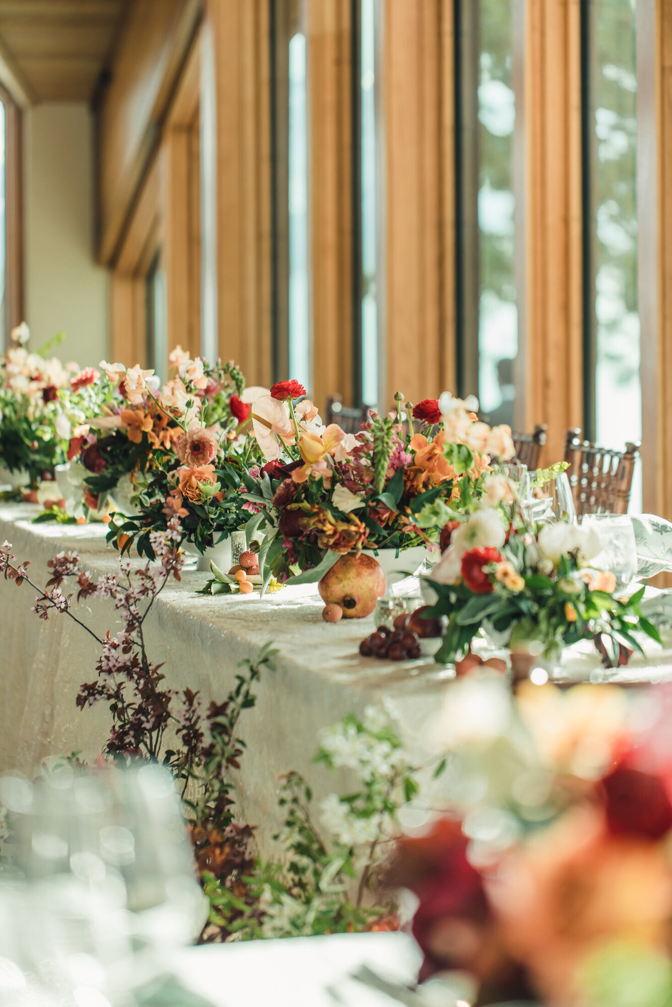 Sunlit reception table florals