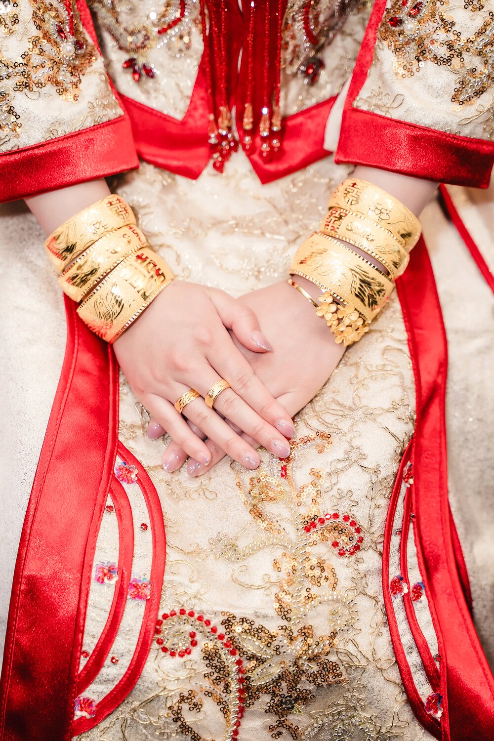 Red and gold Chinese wedding jewelry and dress detail