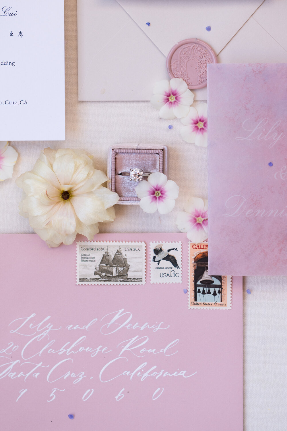 Wedding paper goods with stamps and florals