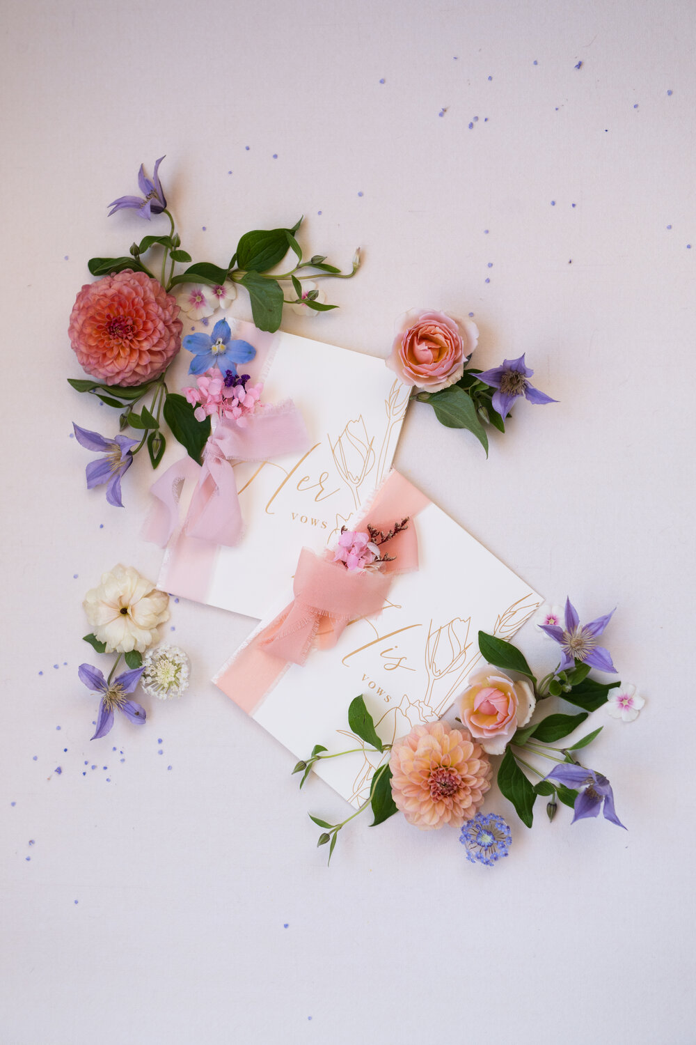 Flatlay of wedding florals and ribbon