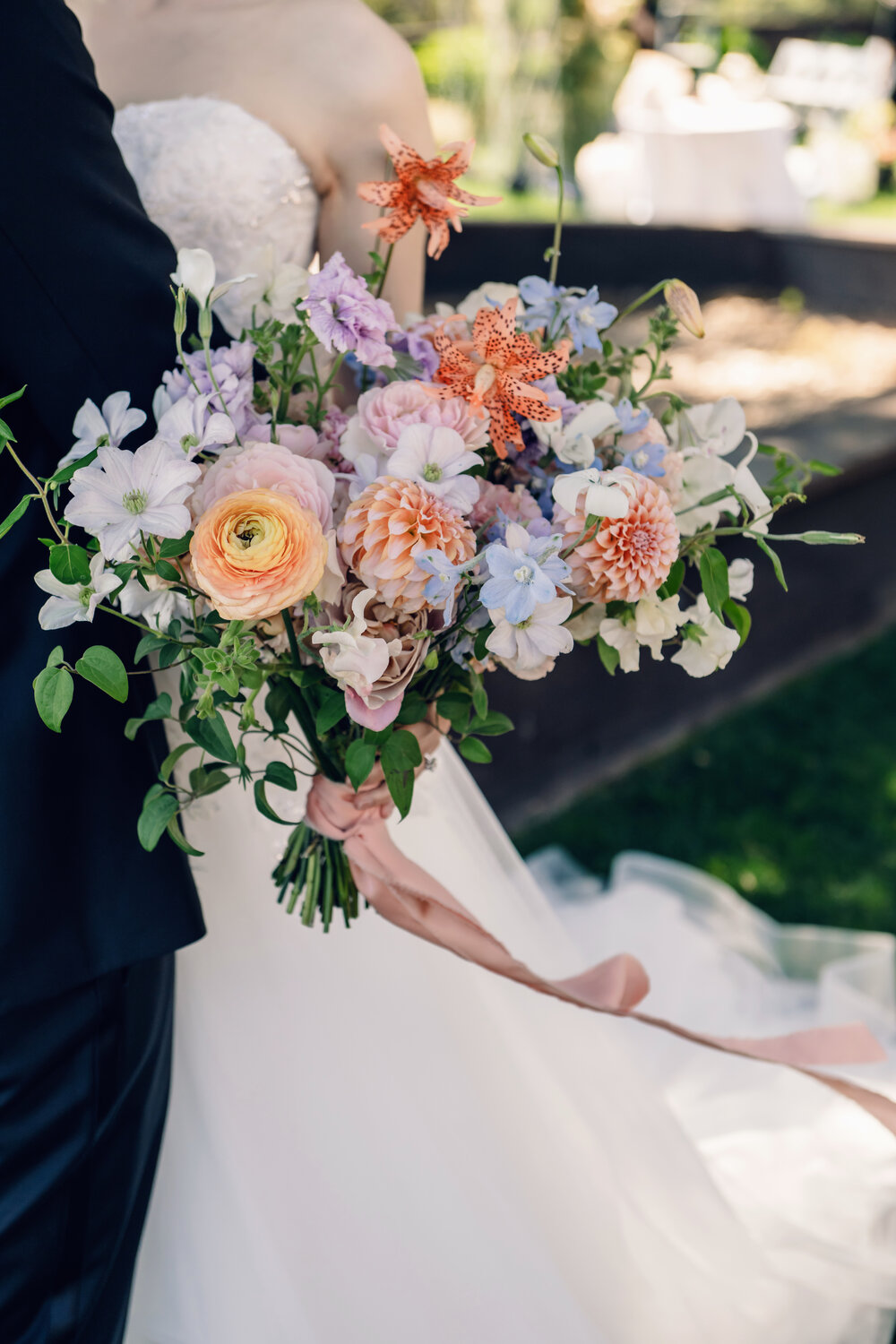 Bride holding a colorful bouquet