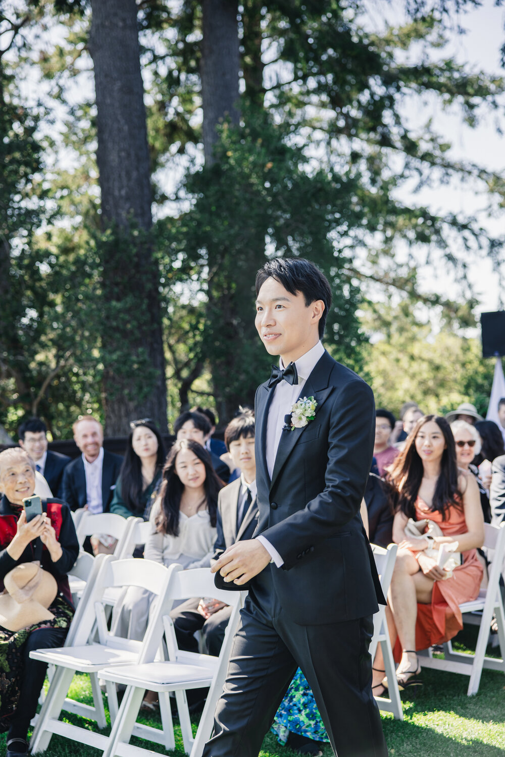 Groom walking down the aisle