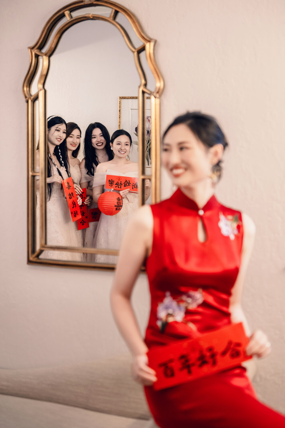 Bride in red dress reflected in the mirror