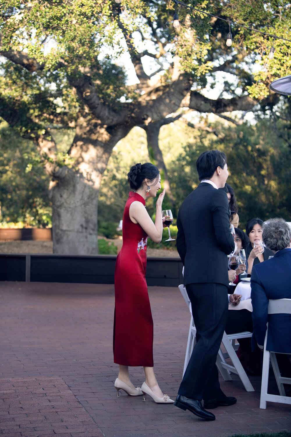 Outdoor moment with bride in red dress
