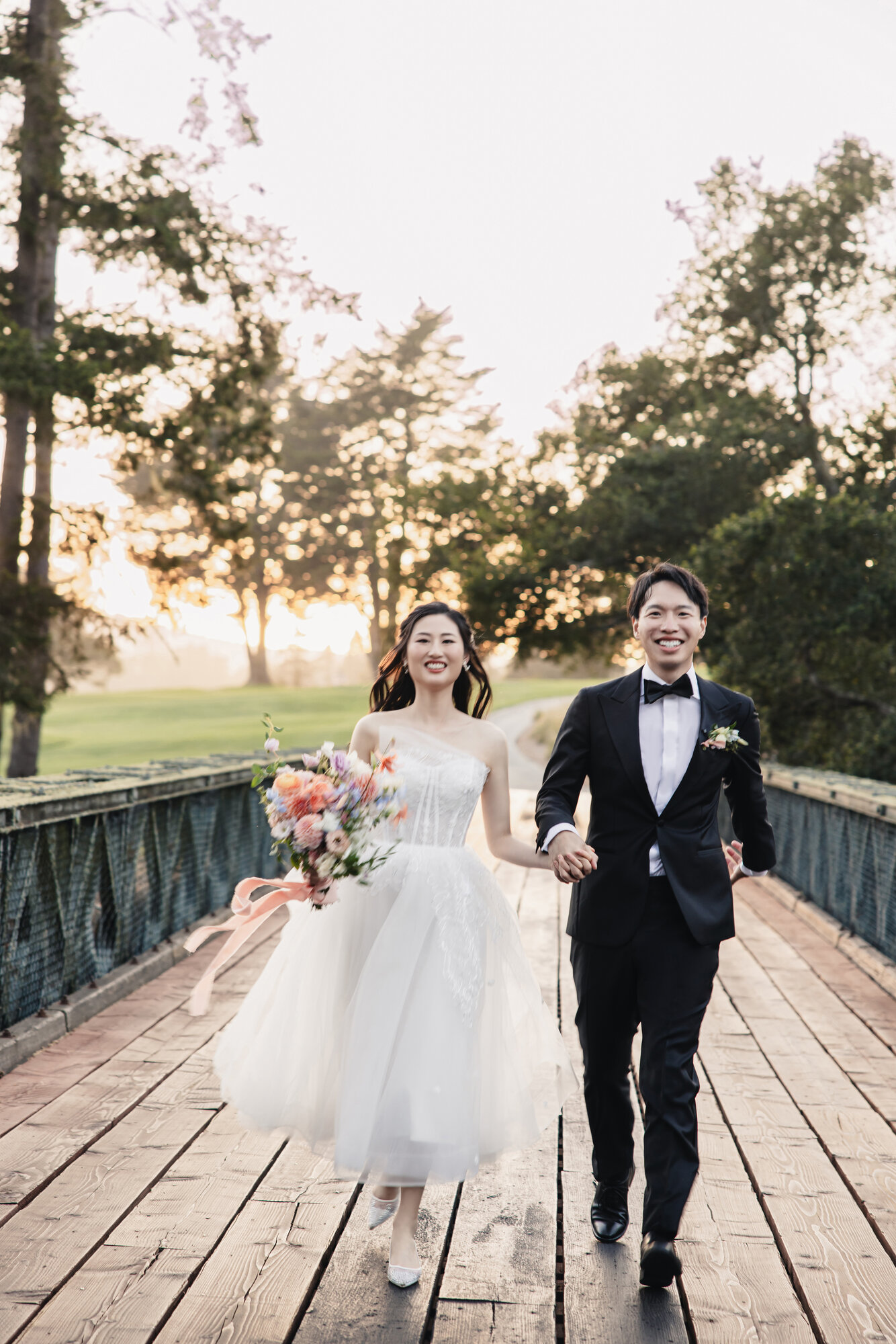 Couple on the bridge at sunset at The Hollins House