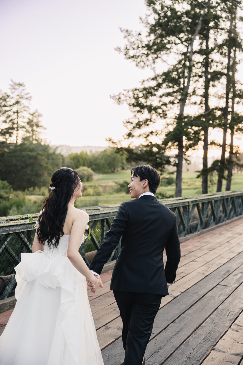 Couple walking along the bridge