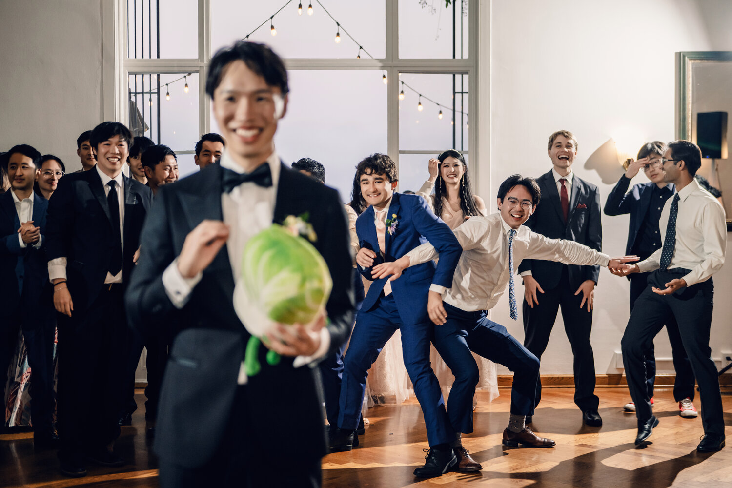 Wedding guest holding watermelon on the dance floor