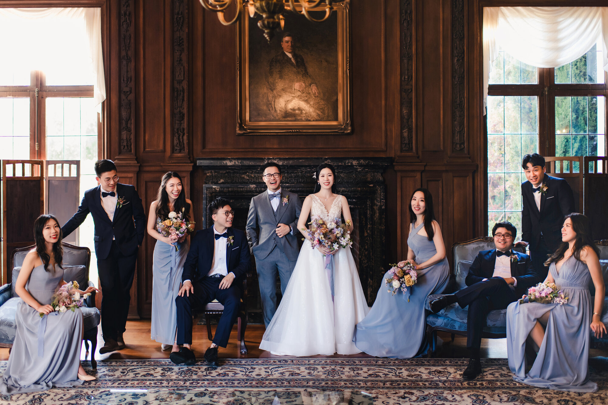 Wedding party portrait inside the wood-paneled room at Kohl Mansion