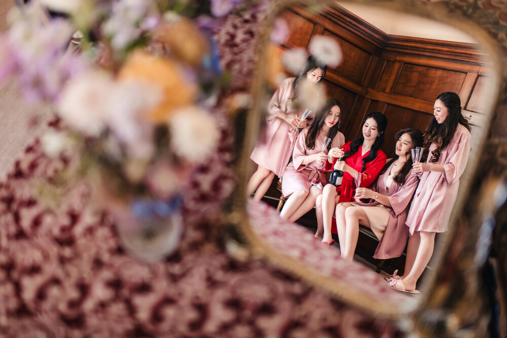 Bridesmaids reflected in the mirror