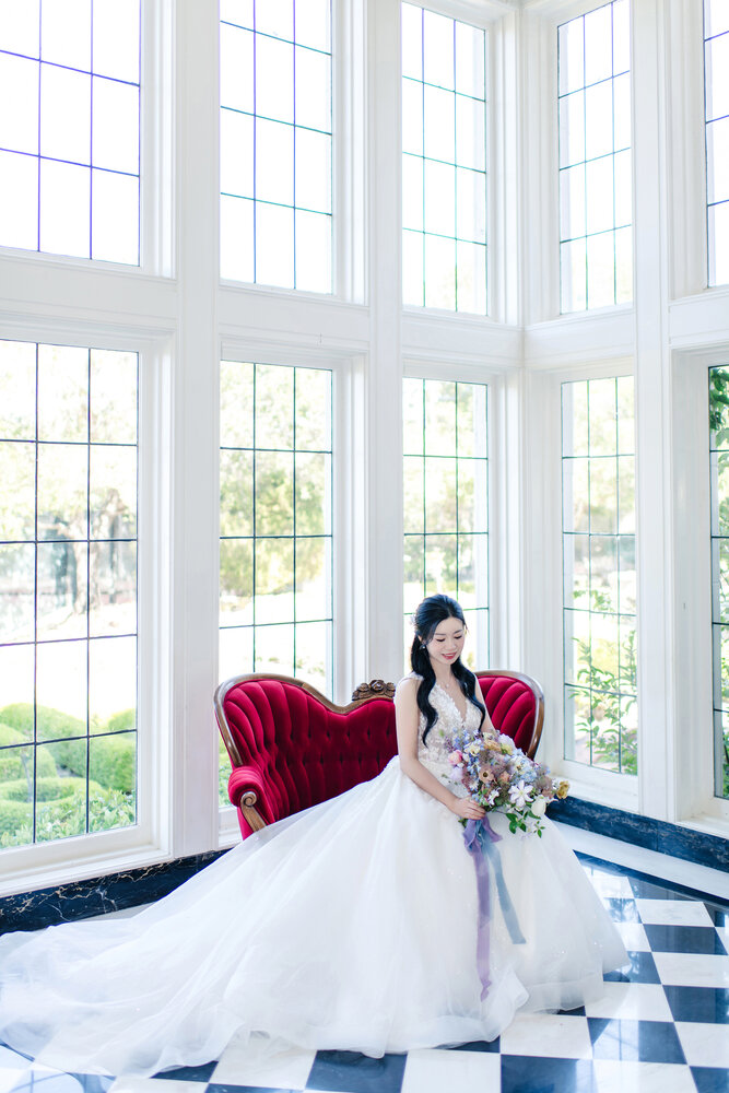 Bride seated in window light