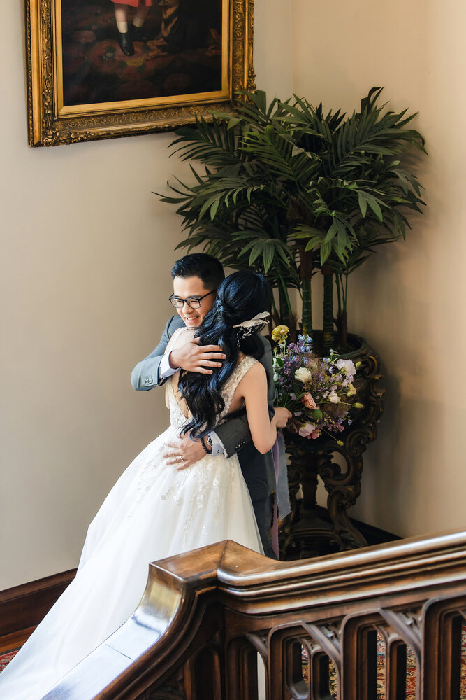 Couple embracing by the staircase