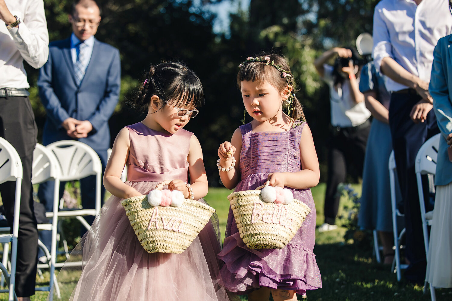 Flower girls walking down the aisle
