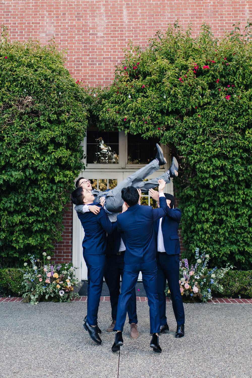Bouquet toss outside the mansion