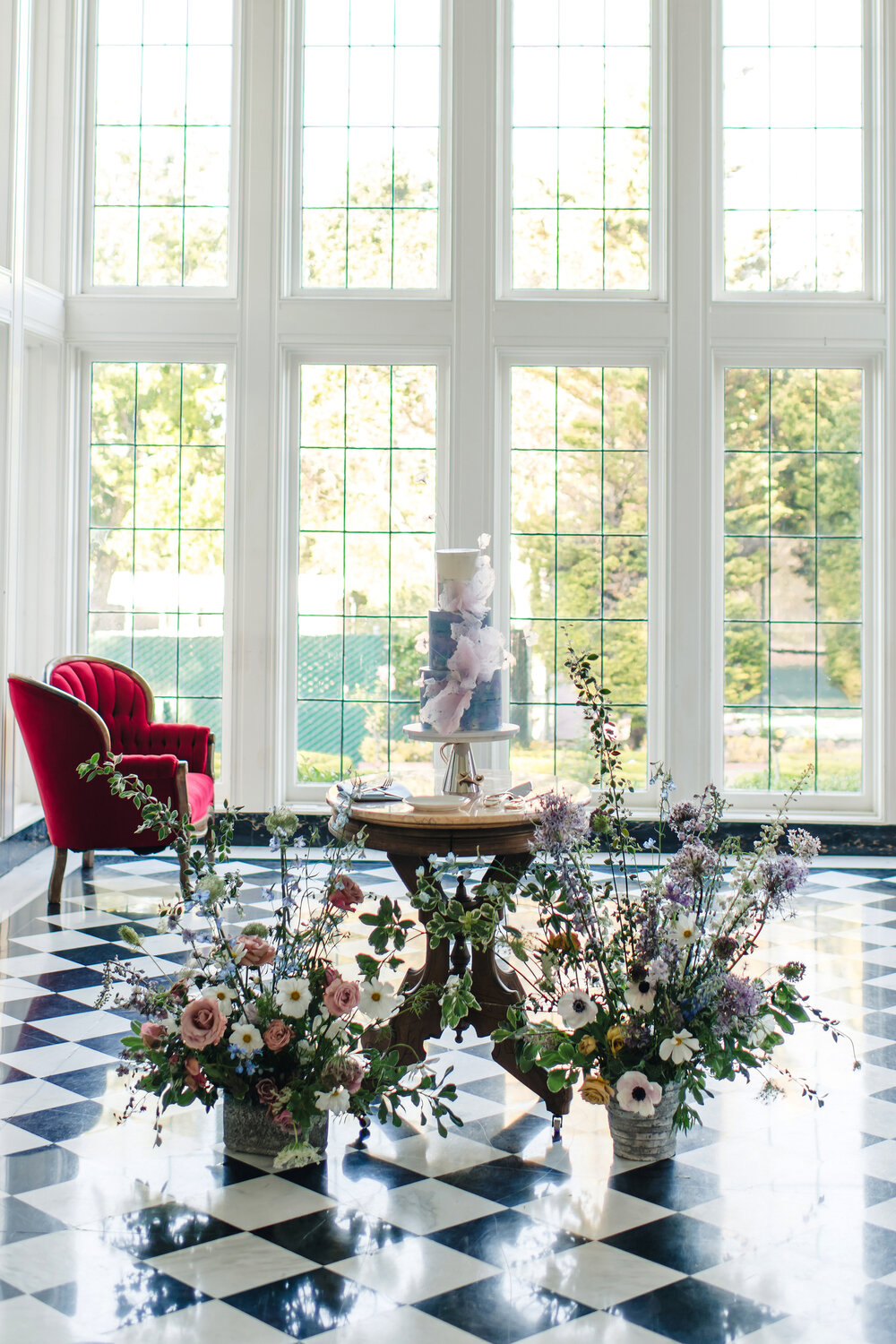 Wedding cake and florals in the window room