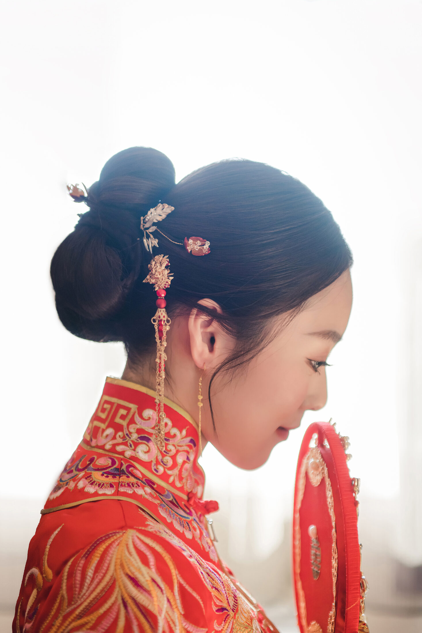 Bride hair and red dress detail