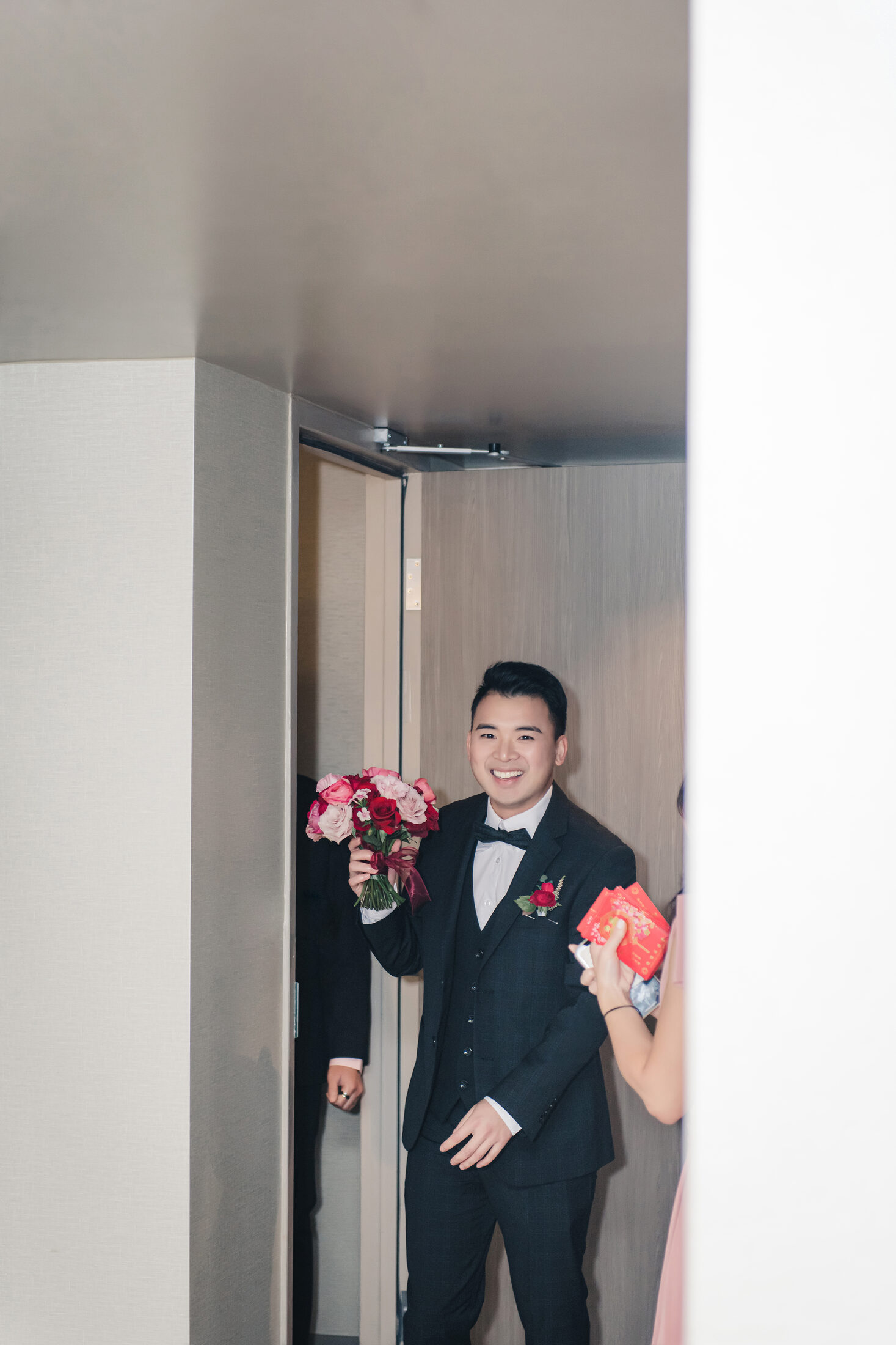 Groom waiting in the doorway