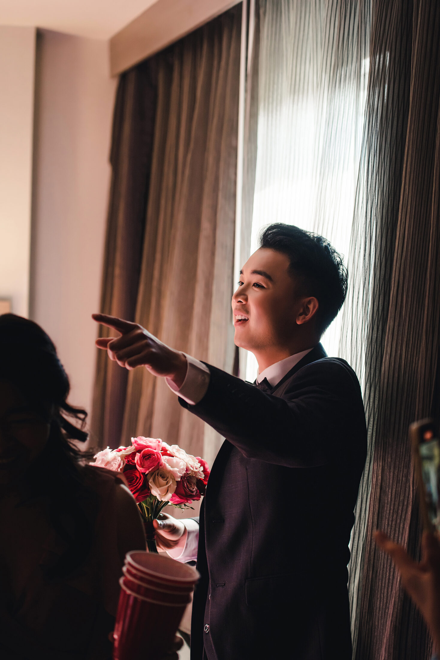 Groom laughing during the door game