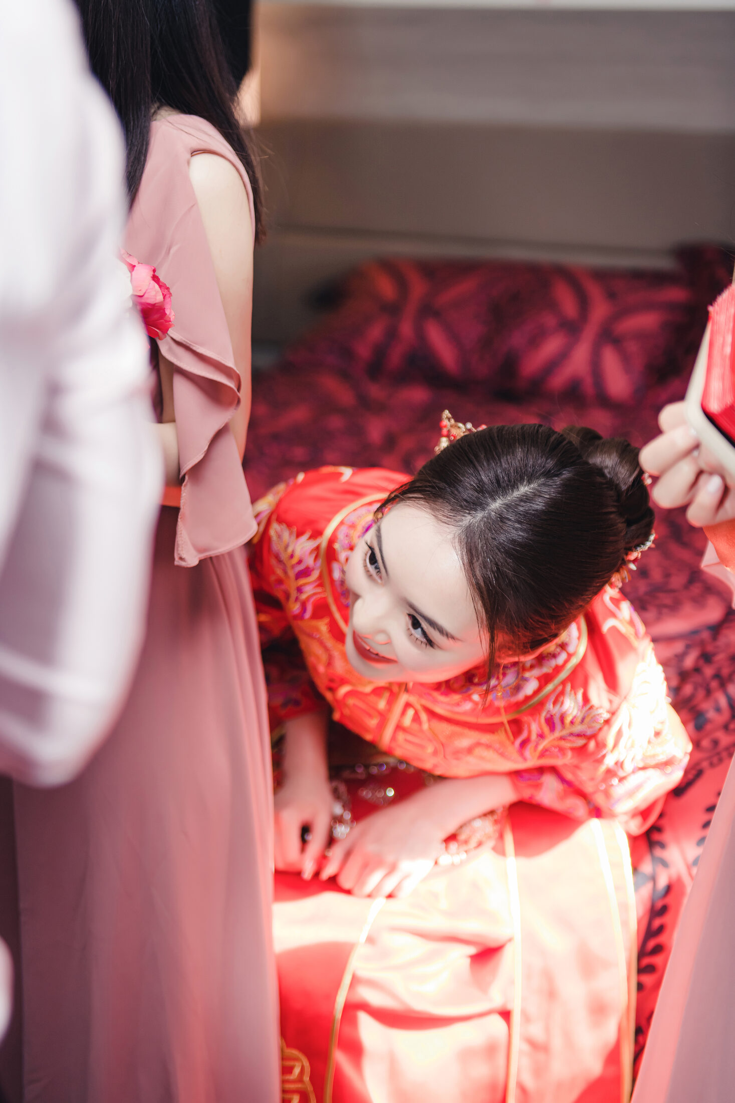 Bride laughing in red dress