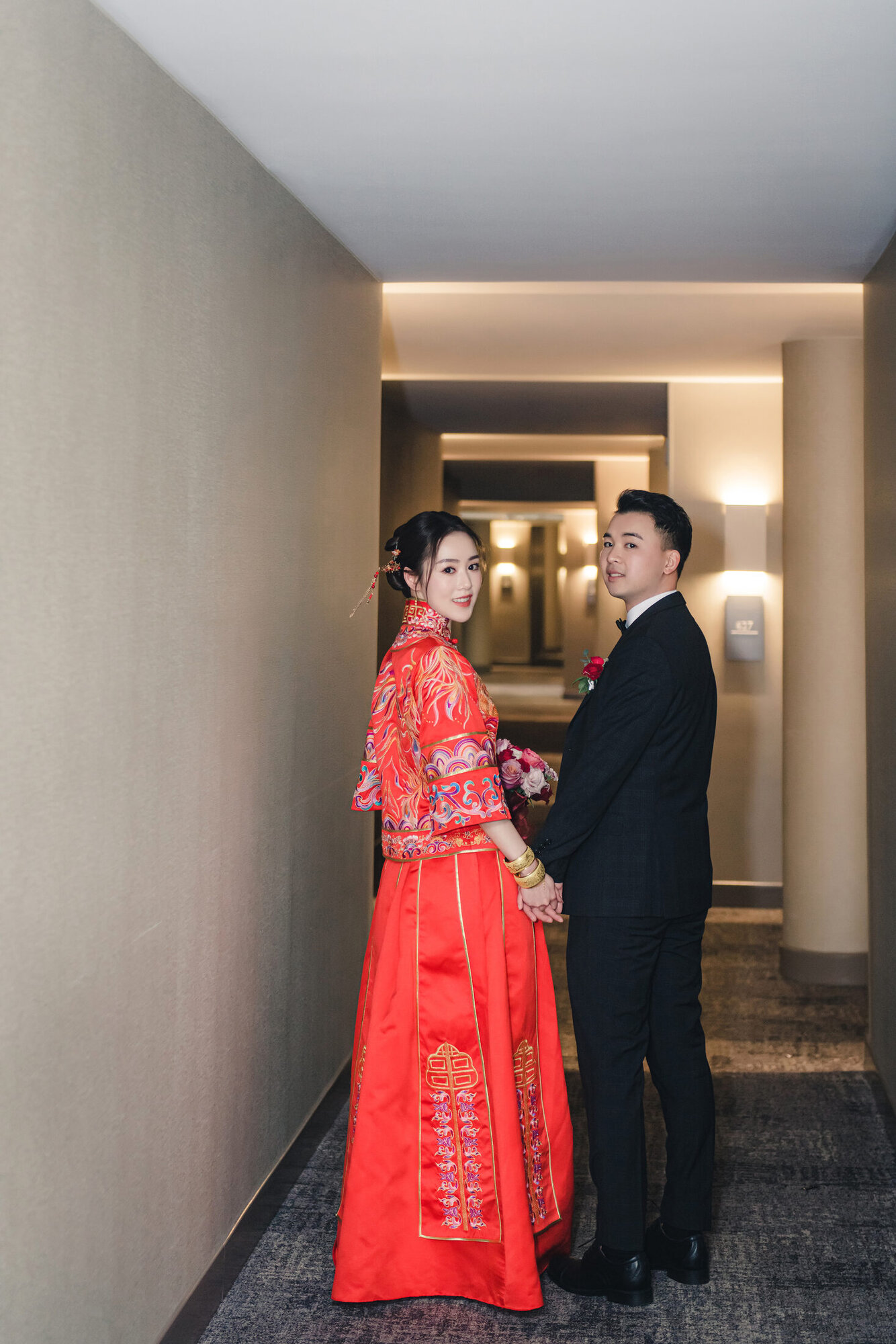 Couple in red dress in the hallway