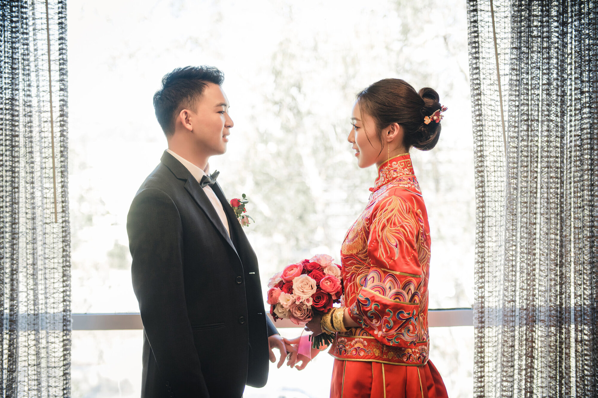Couple in red by the window
