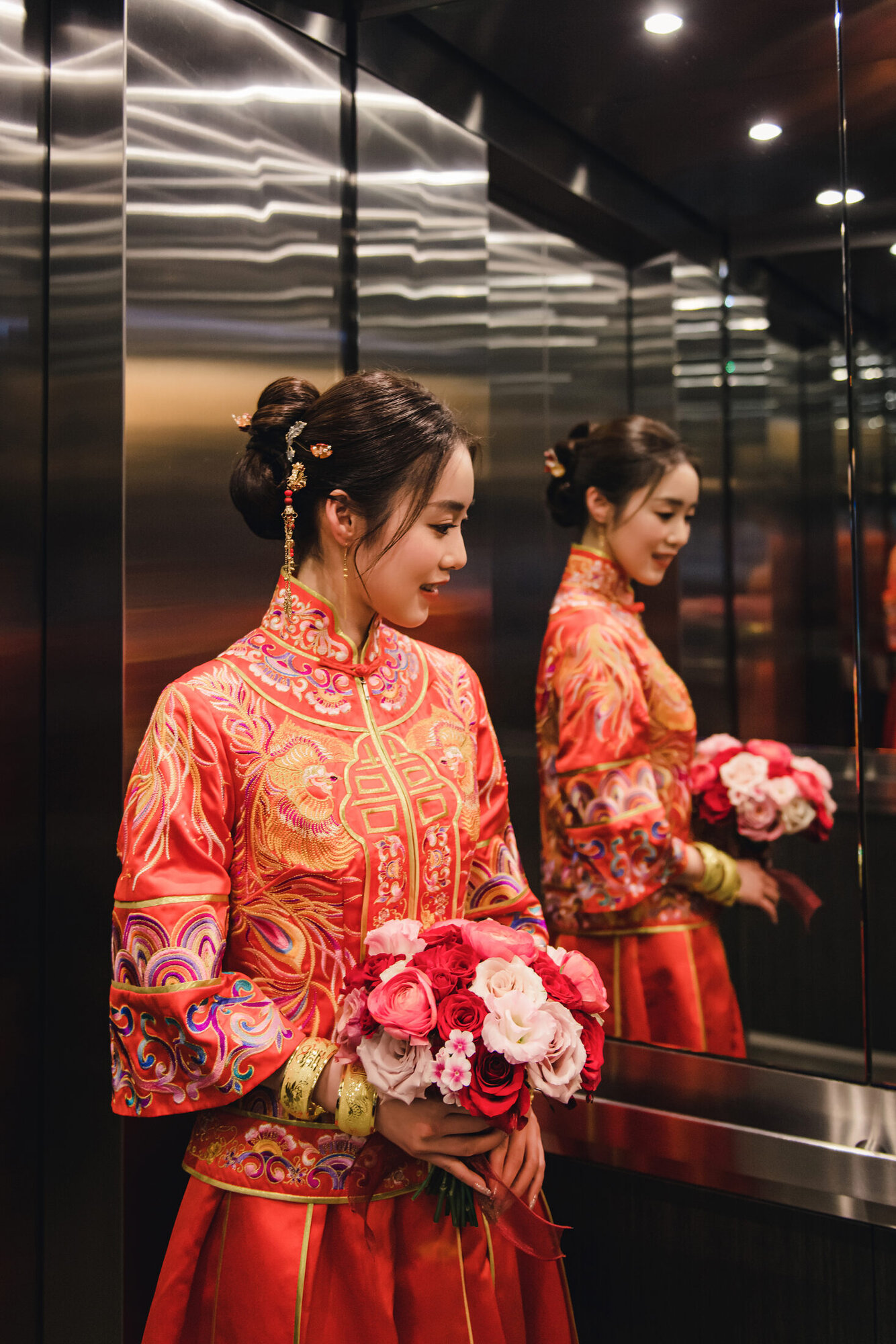 Bride reflected in elevator mirror
