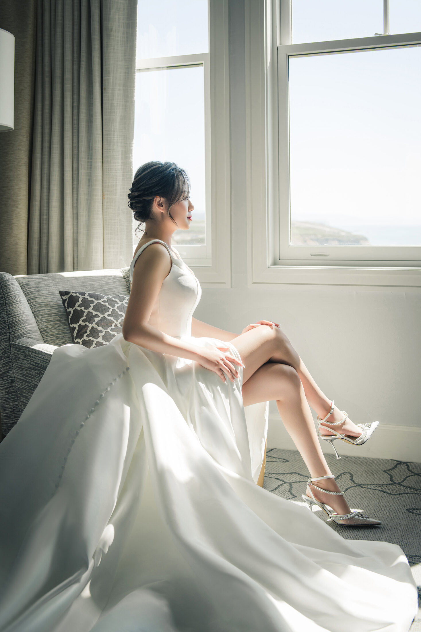 Bride seated by the window