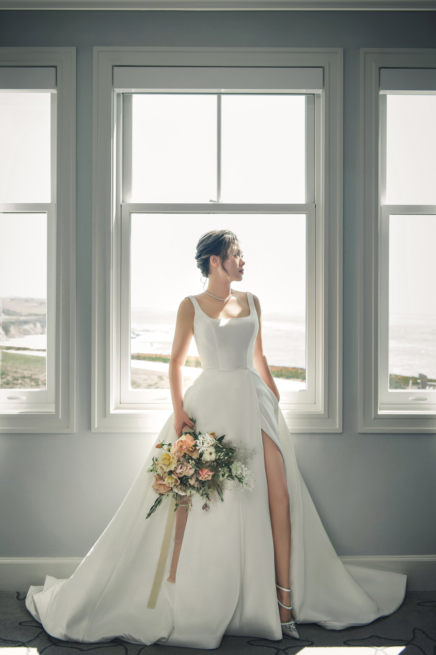 Full bride portrait by the window