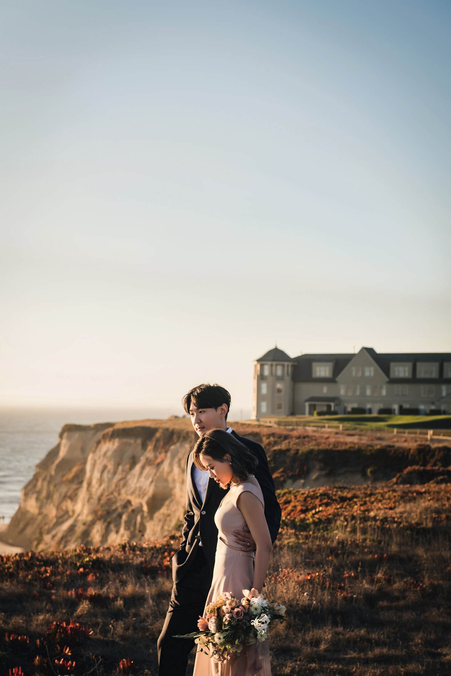 Sunset couple portrait by the coast
