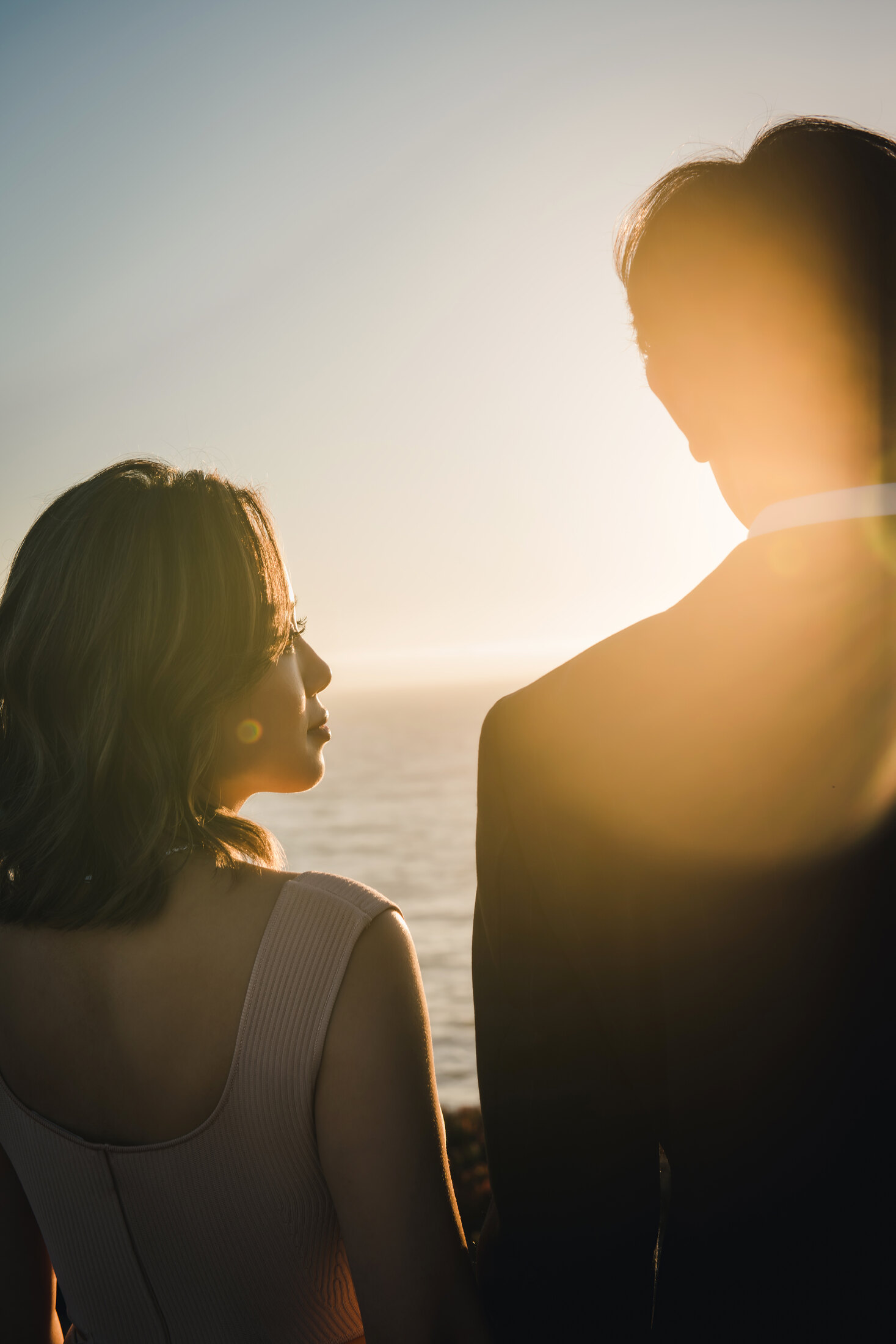 Backlit sunset couple portrait