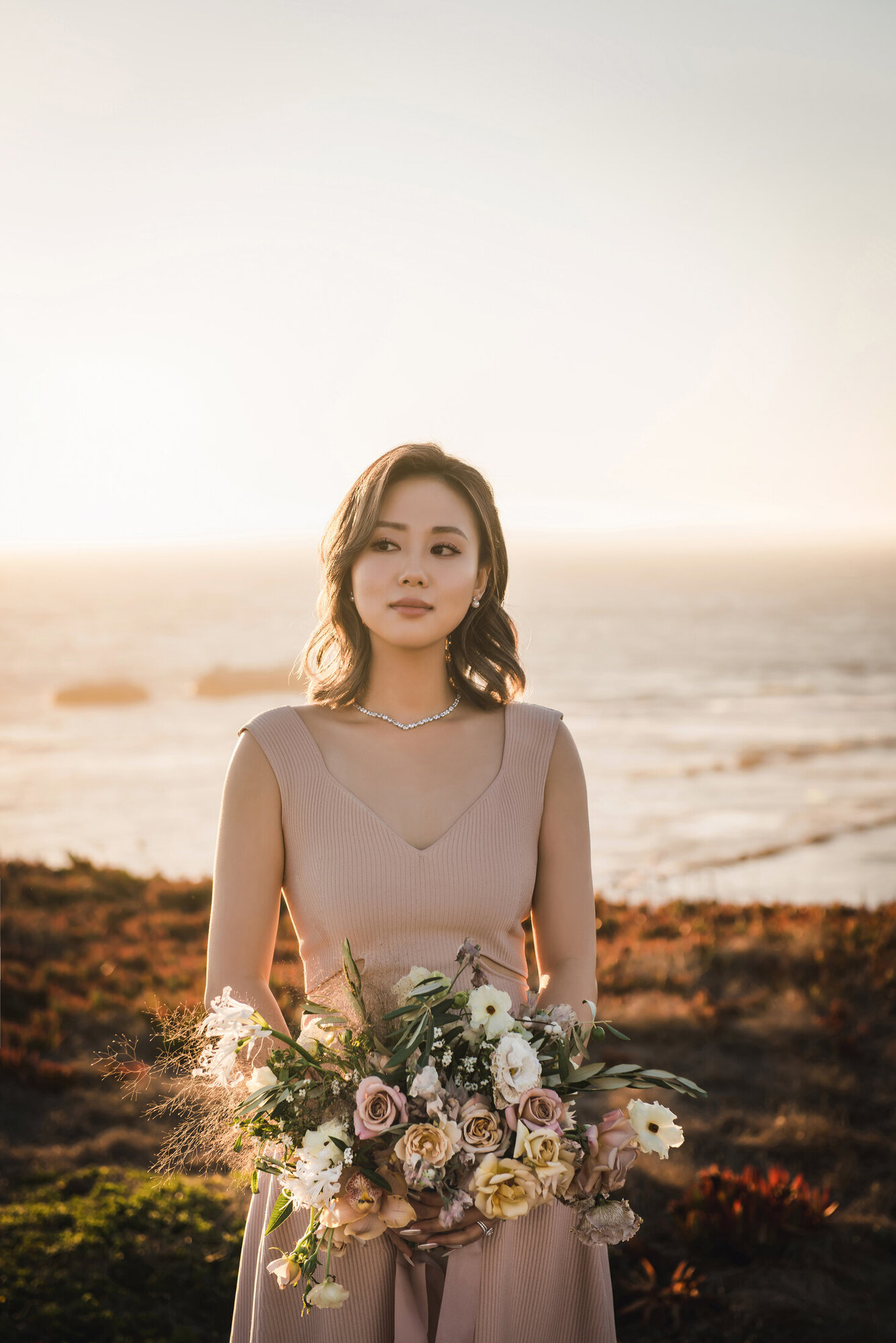 Bride portrait by the sunset coast
