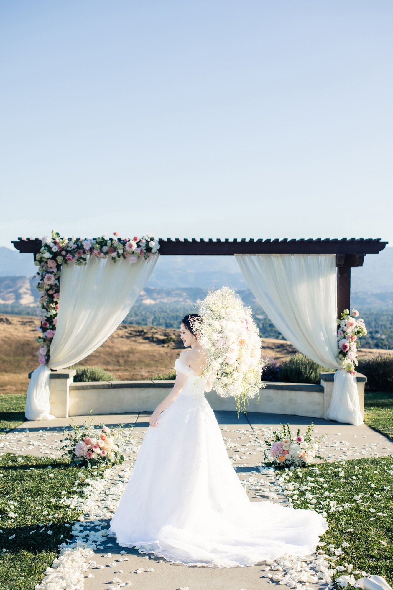 Bride portrait at the floral arch