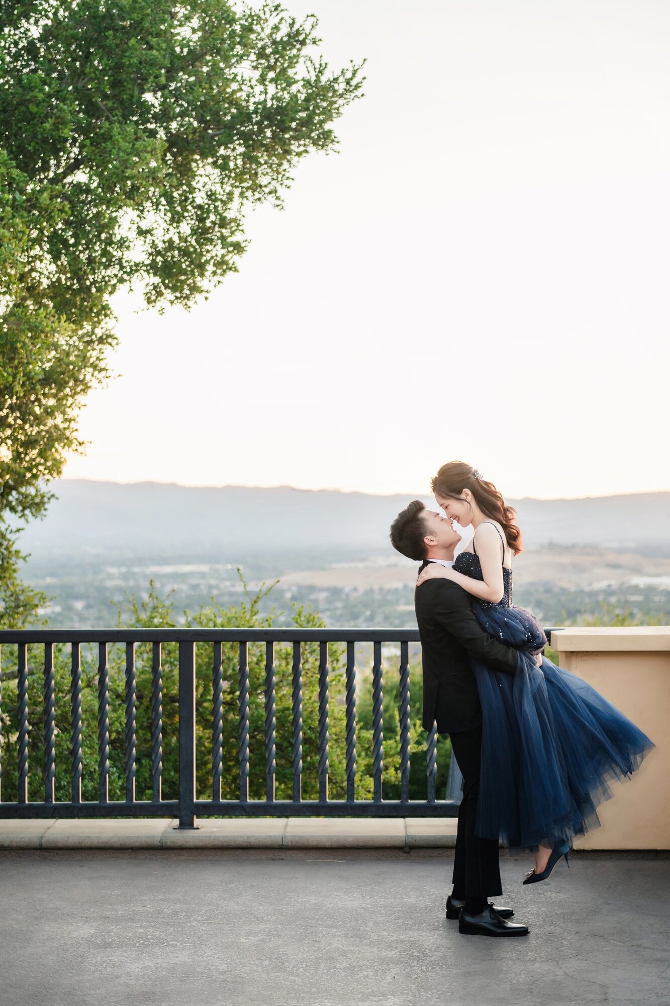 Blue dress portrait by the hillside