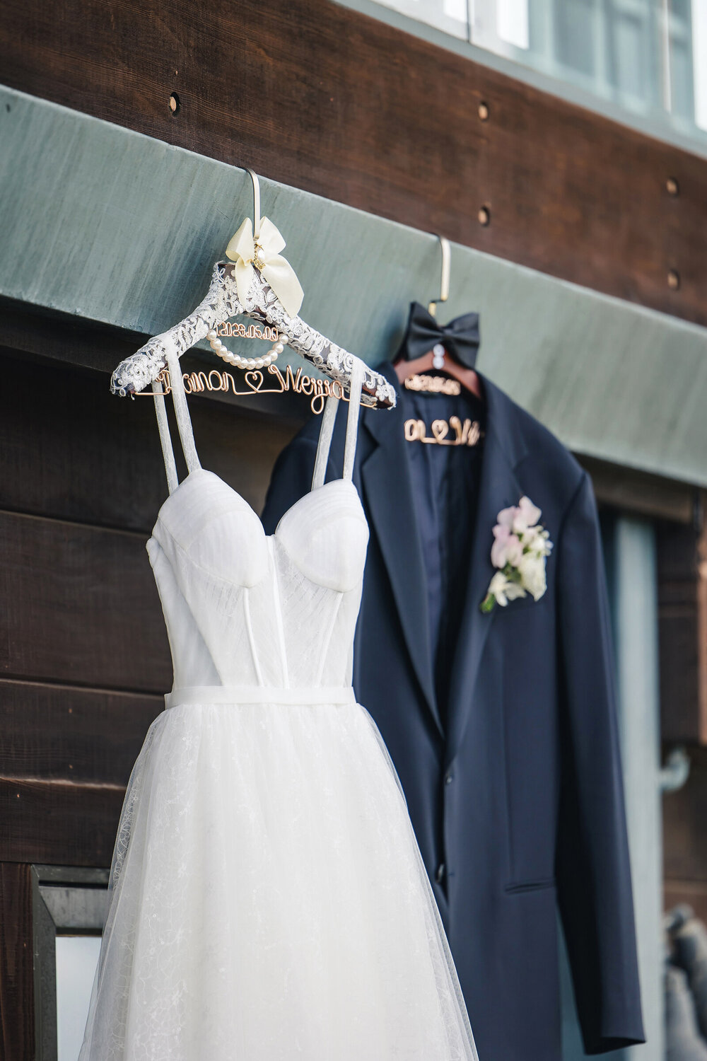 Wedding dress hanging by the window