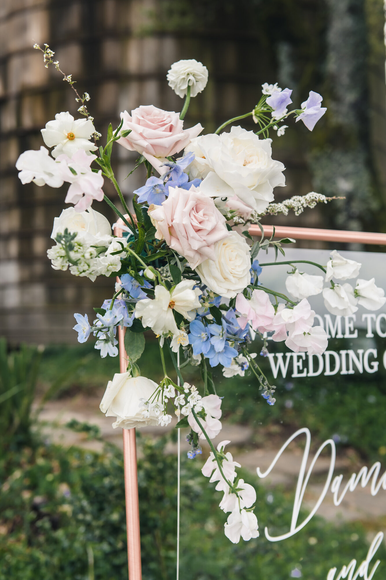 Ceremony welcome sign and floral detail