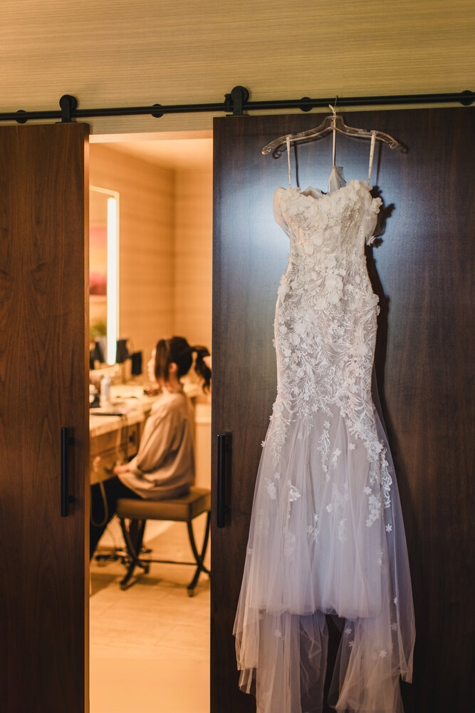 Wedding dress hanging by the doorway
