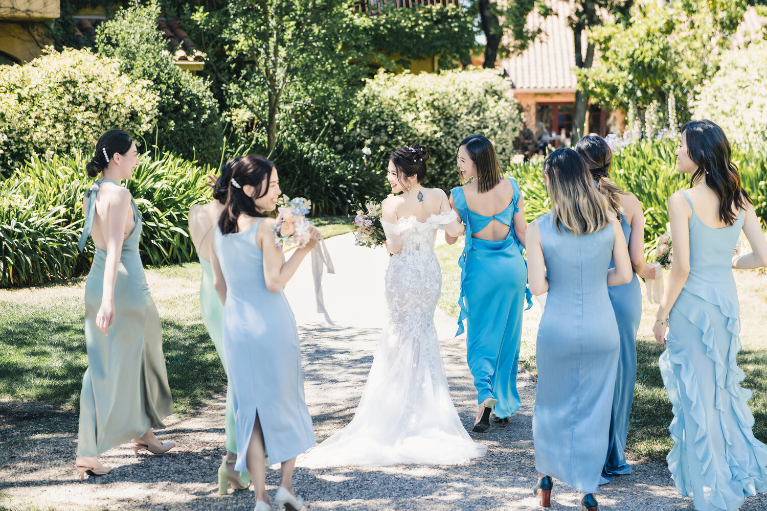 Bride walking with bridesmaids